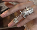 Silver Dangle Bell and Cross Ring